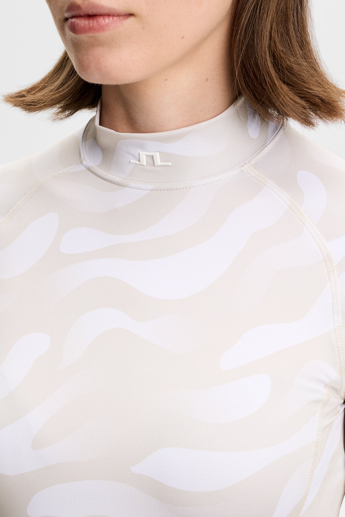 Top a compressione J.Lindeberg Ella Print &ndash; UPF 40+ e gestione dell'umidità