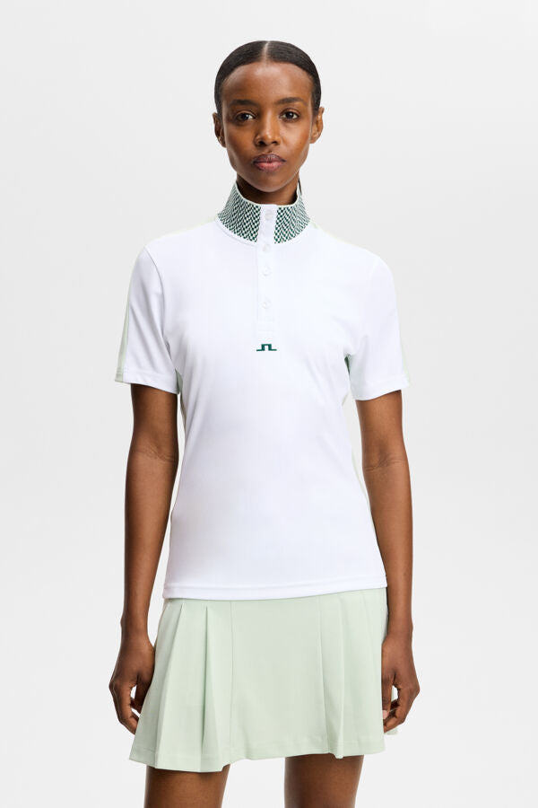 J.Lindeberg Pip Polo White – vista frontale che mostra il colletto jacquard e l'abbottonatura